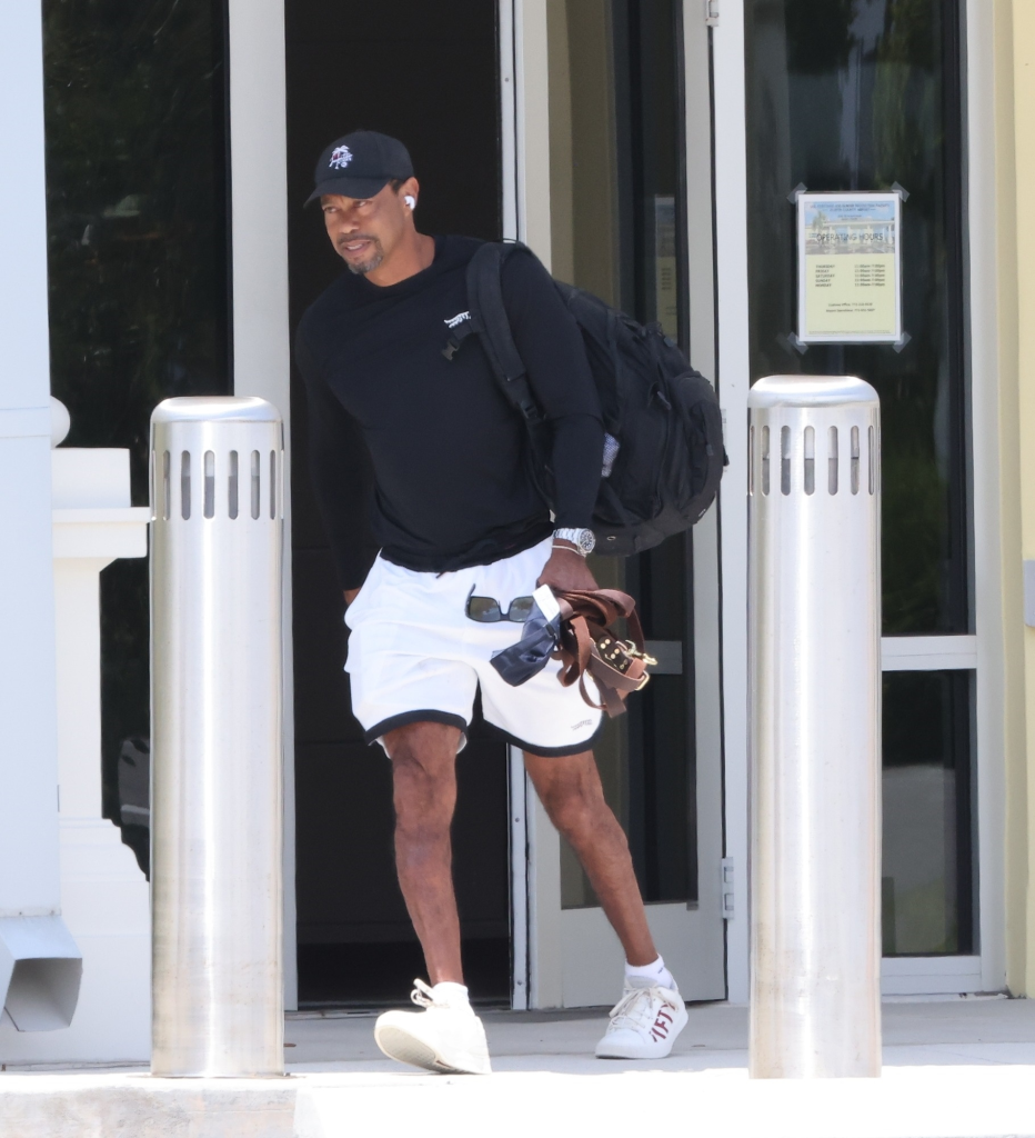 Tiger Woods exits a private airport after rehab in Switzerland.
