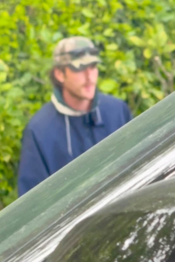 Jacob Elordi wearing a camouflage hat and navy jacket.
