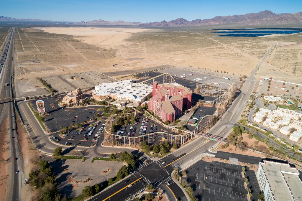 Aerial view of Primm Valley Resort and Casino in Nevada, with a desert and mountains in the background.