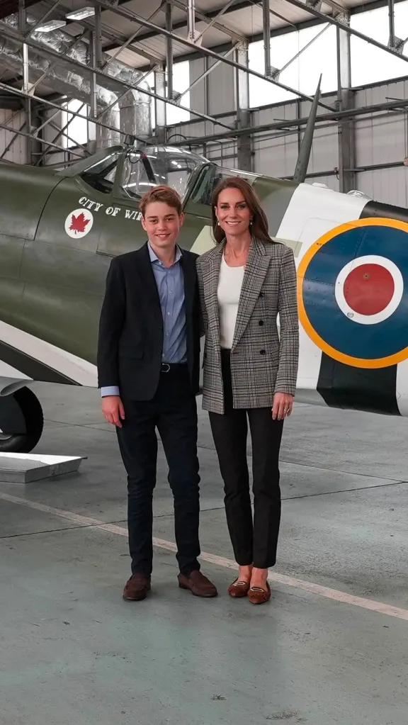 Prince George and Kate stand in front of a historic plane at the Britain Memorial Flight.