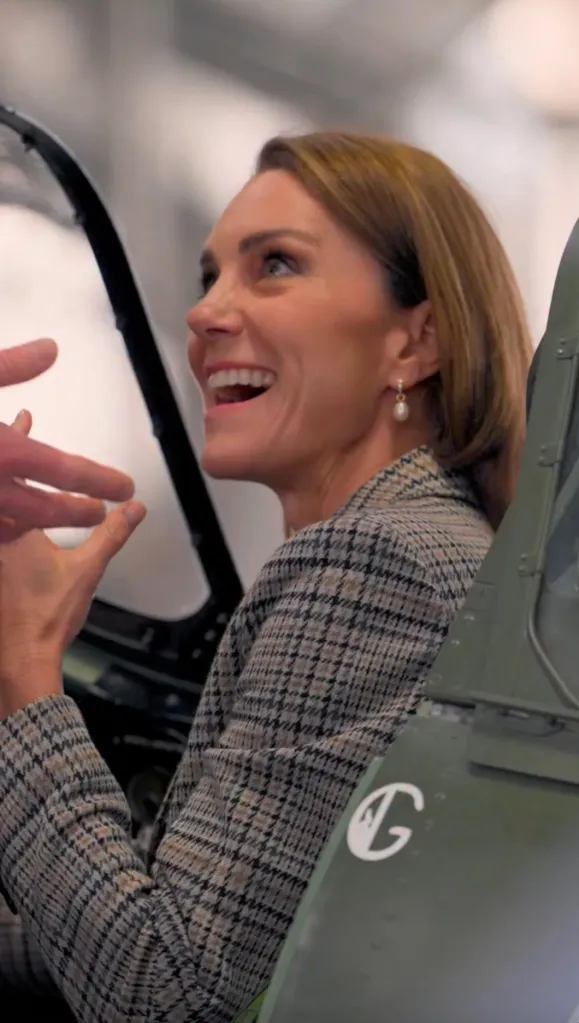 Kate Middleton smiling in an aircraft cockpit at RAF Coningsby.