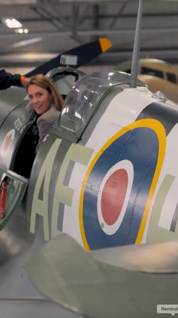 A woman in the cockpit of a British fighter plane.