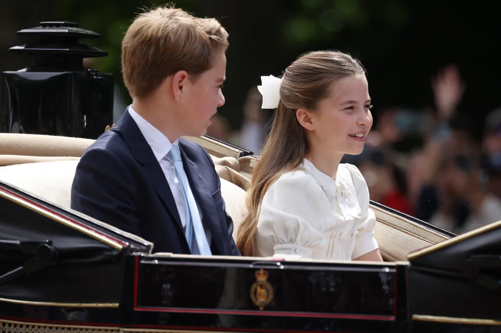 Prince George and Princess Charlotte of Wales in a carriage during Trooping The Colour.