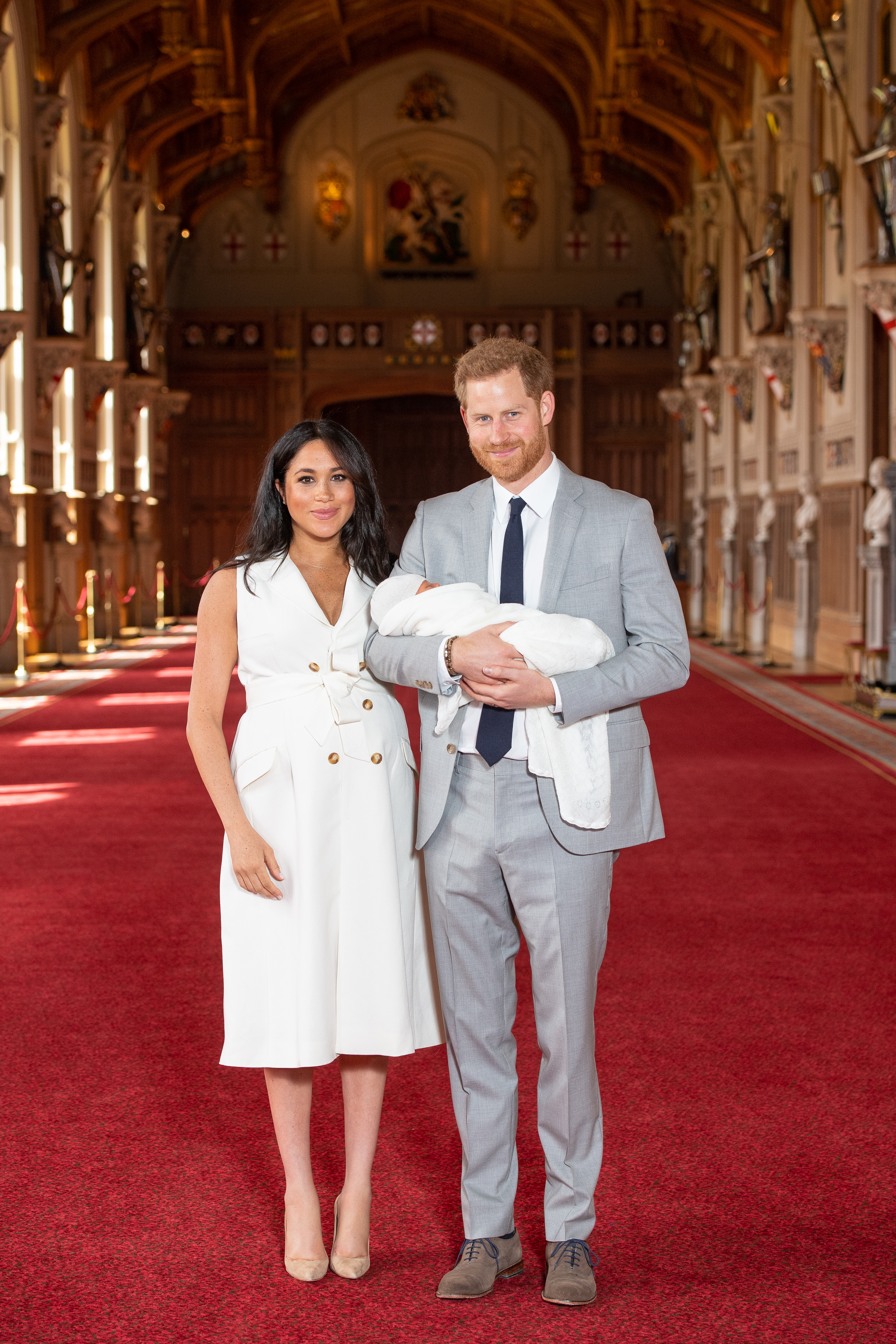 Prince Harry, Duke of Sussex and Meghan, Duchess of Sussex, pose with their newborn son Archie Harrison