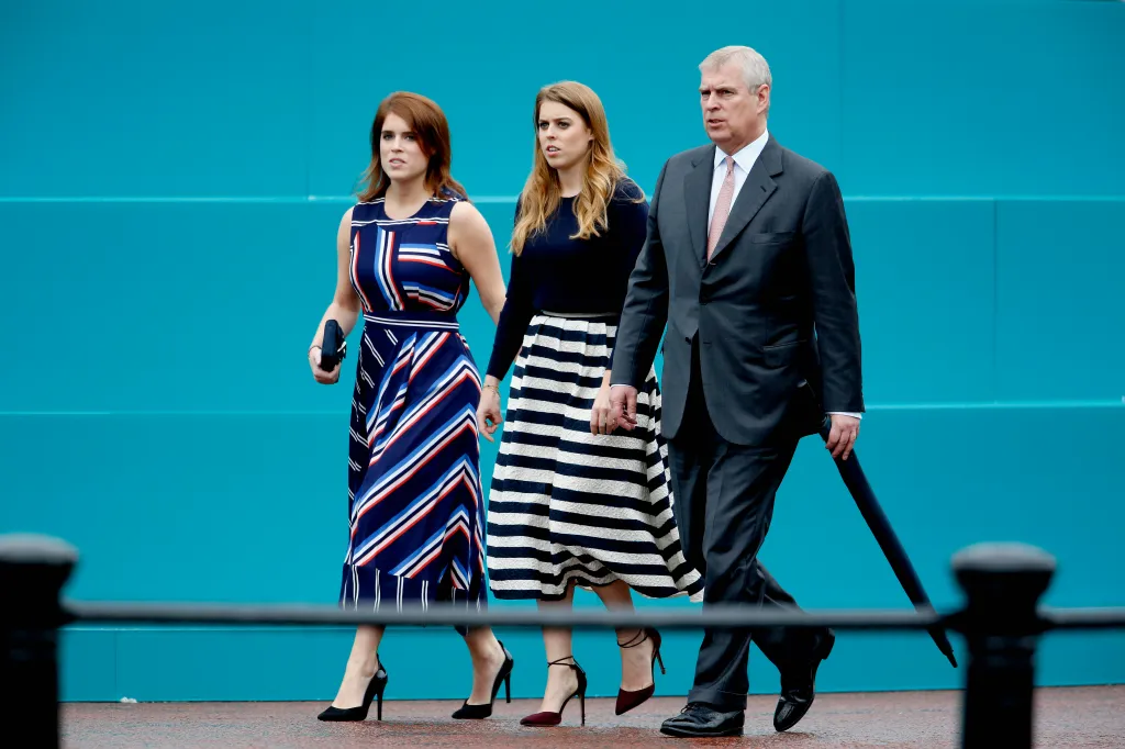 Princess Eugenie, Princess Beatrice, and Prince Andrew walking at The Patron's Lunch.