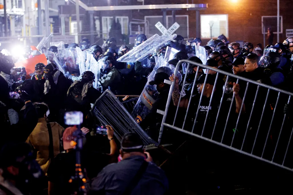 Protesters clash with police outside Delaney Hall in Newark, New Jersey.
