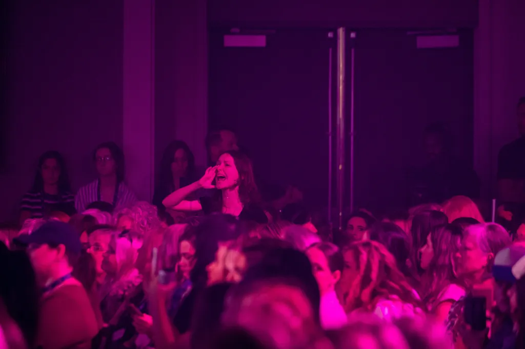 A protestor shouts as CEO of Turning Point USA, Erika Kirk, speaks during the Turning Point Women's Leadership Summit in San Antonio, Texas, U.S., June 5, 2026. 
