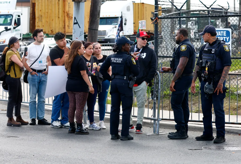 Protesters talking to Newark Police at a barricade near Delaney Hall.