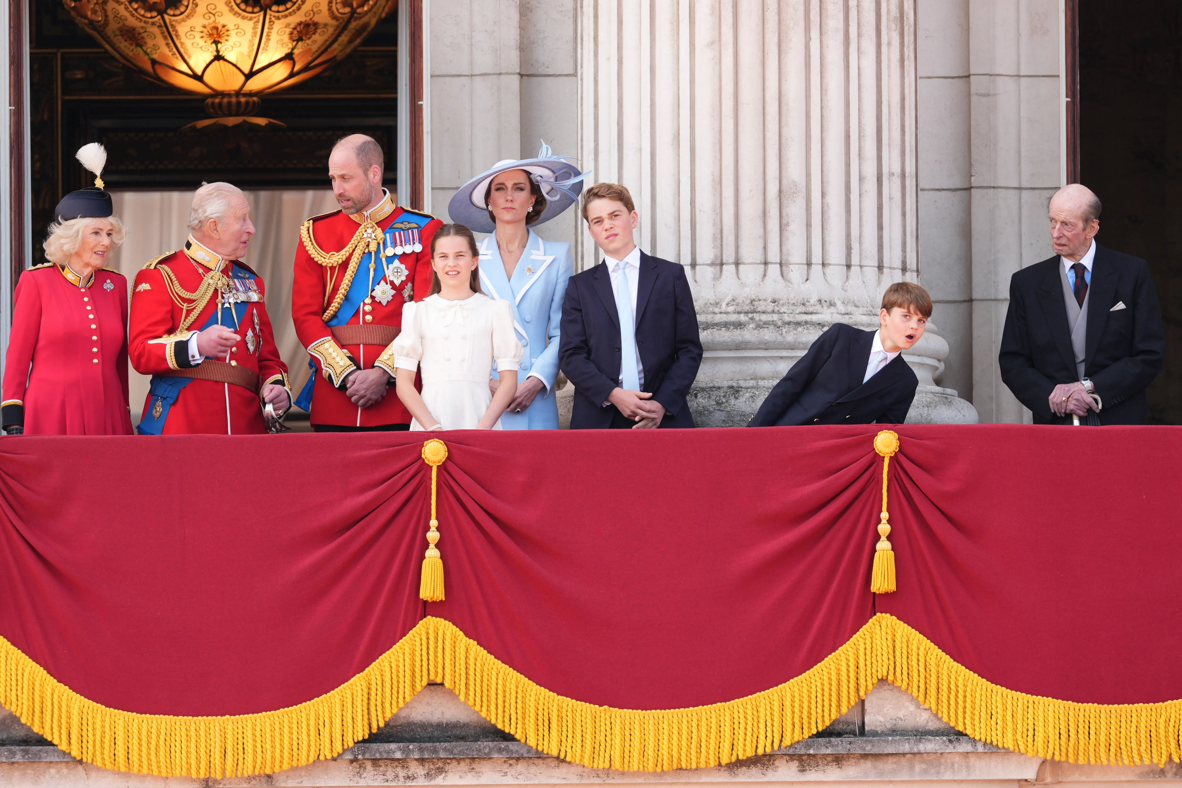 Queen Camilla, King Charles III, Prince William, Princess Catherine, Princess Charlotte, Prince George, Prince Louis, and the Duke of Kent on the Buckingham Palace balcony.