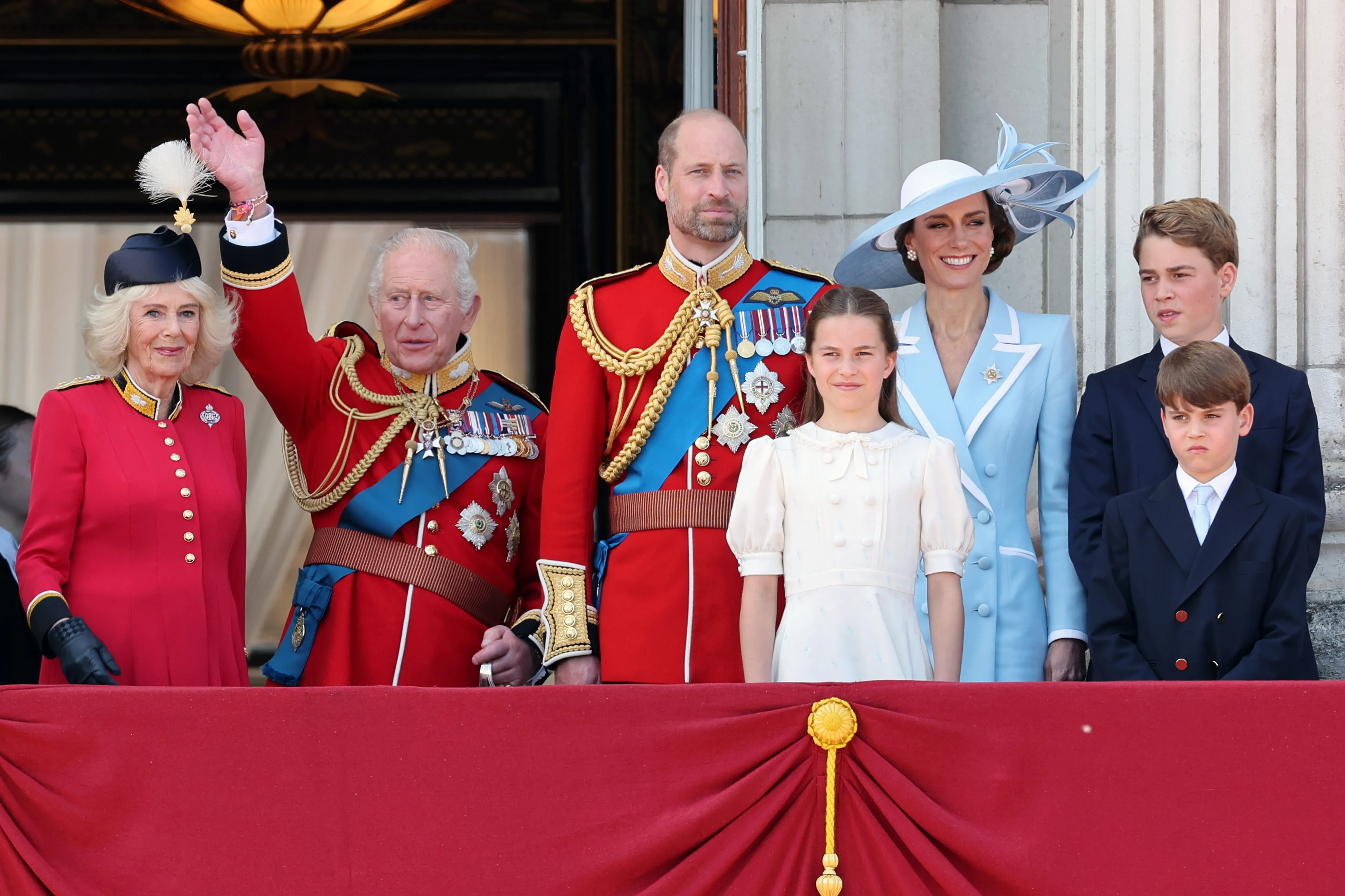 Members of the British royal family watch an RAF flypast from the balcony of Buckingham Palace.