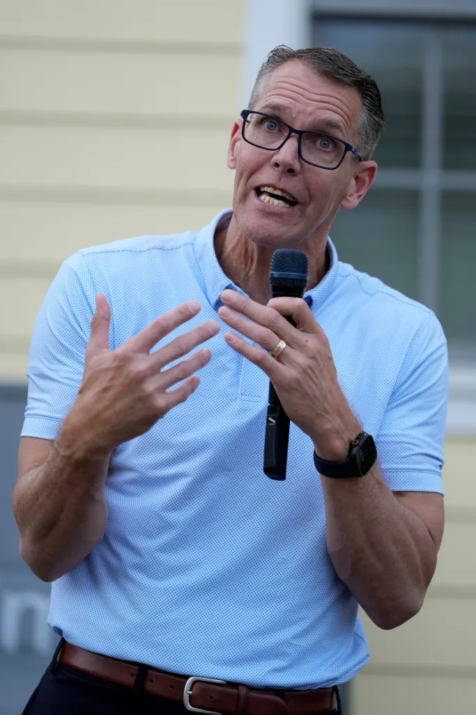 Rep. Randy Feenstra, R-Iowa, speaking into a microphone with his hands gesturing.