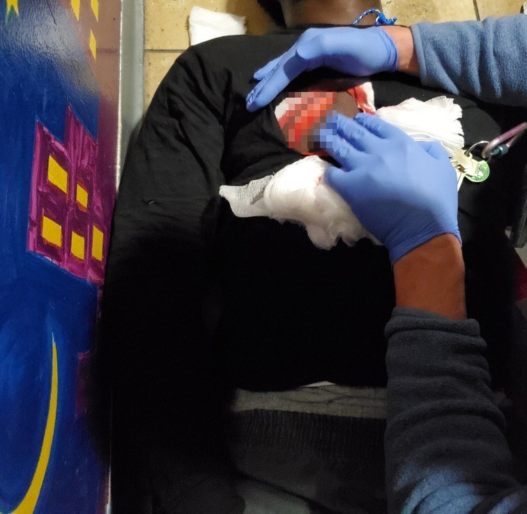 Medical personnel treating a resident after a near-fatal stabbing at Horizon Juvenile Center.