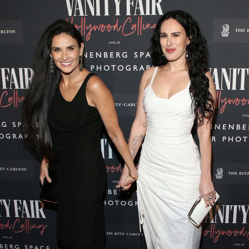 Demi Moore and Rumer Willis holding hands at a 