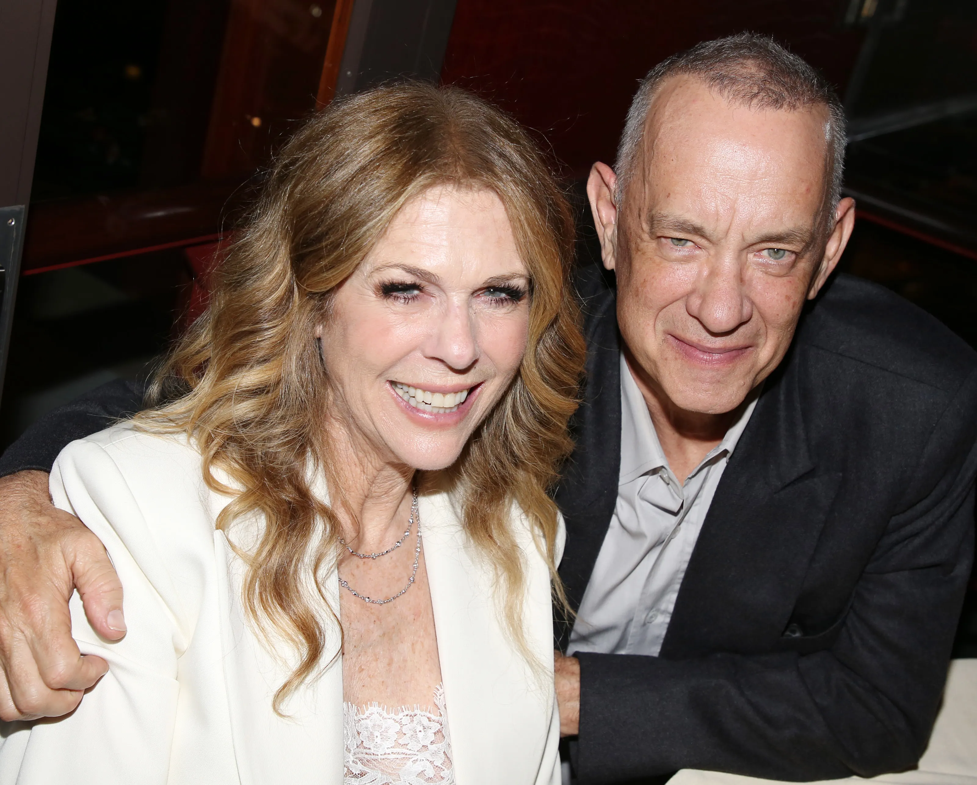Rita Wilson and Tom Hanks posing at the opening night after-party for 