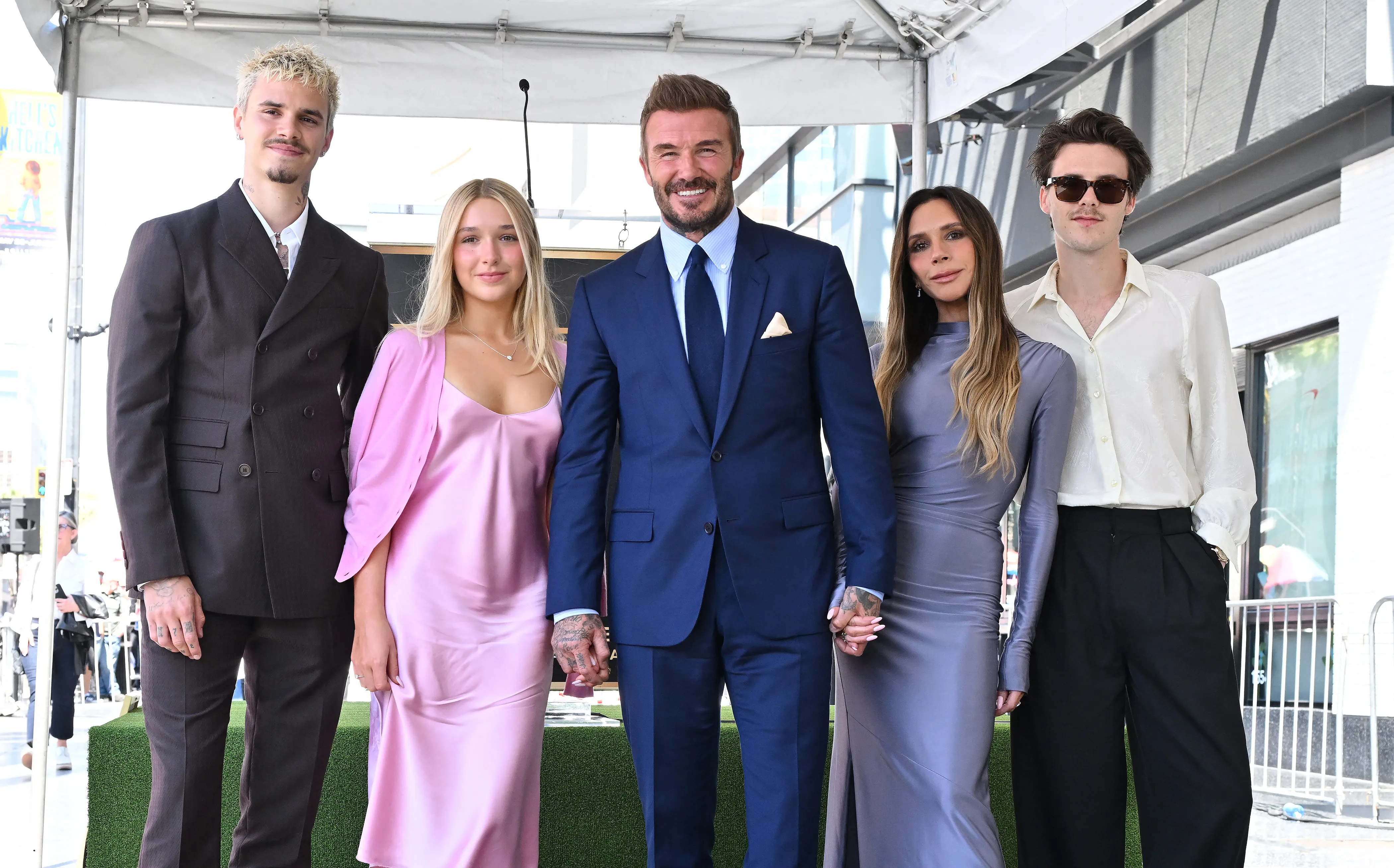 David Beckham poses with his children Romeo, Harper, Cruz, and wife Victoria Beckham at his Hollywood Walk of Fame star unveiling.