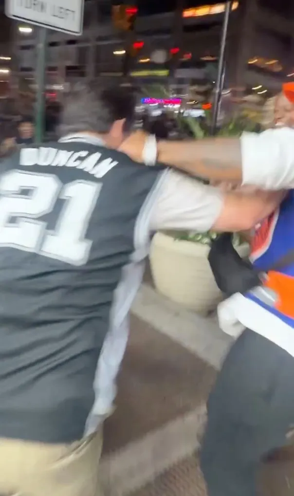 The Spurs fan appeared to try to fight back, but was forced to the ground and kicked repeatedly before trying to escape down a street as antagonizers chased at his heels