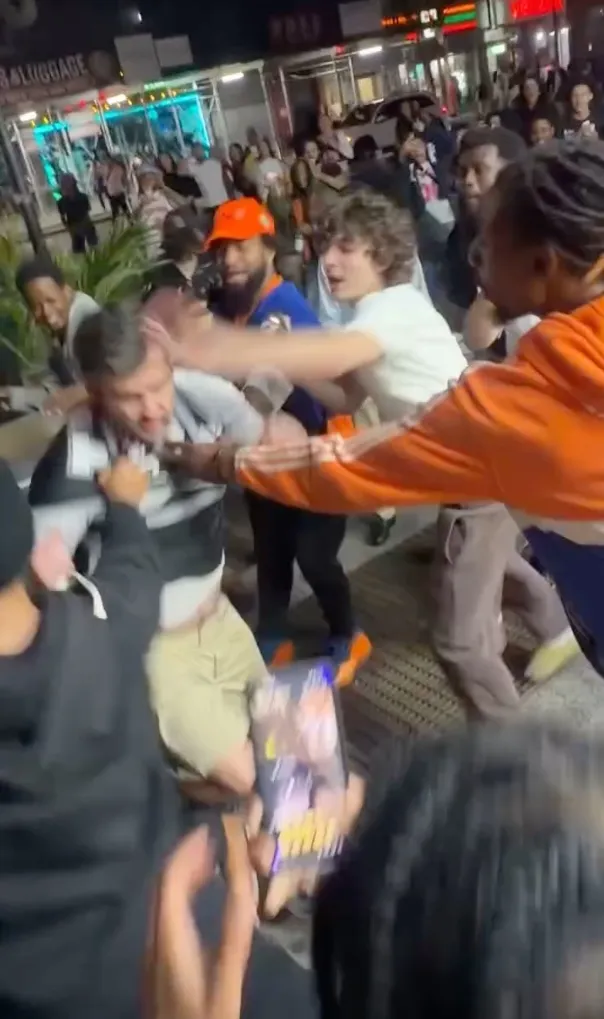 A rowdy mob pummeled a San Antonio Spurs fan and snatched his jersey in a viral caught-on-camera beatdown amid the mayhem that broke out in Midtown on June 9, 2026.