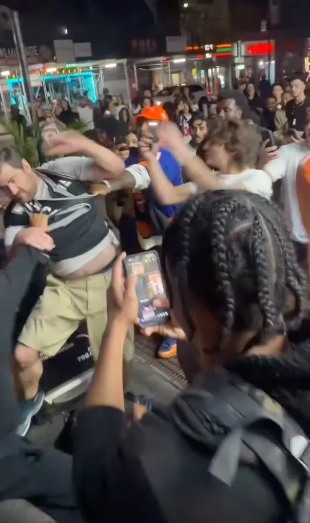 The 39-year-old Spurs fan was walking back to his hotel just after midnight on Tuesday when the large crew descended upon him outside 306 West 47th Street, according to the NYPD.