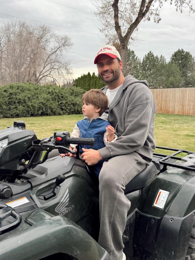 Dakota Mortensen and son Ever on an ATV.