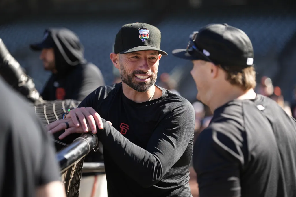Sam Hentges #31 and Drew Gilbert #0 of the San Francisco Giants at Oracle Park.