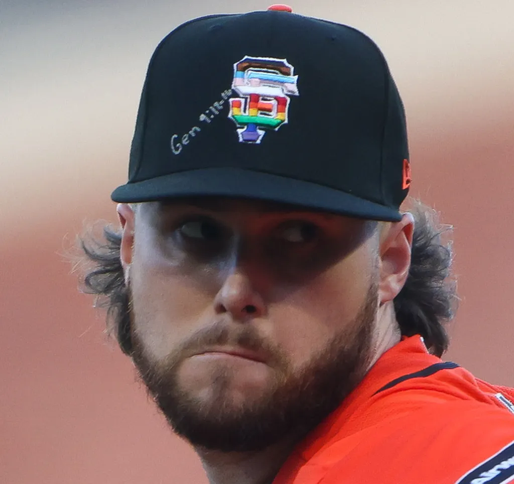 San Francisco Giants pitcher Landen Roupp with a rainbow-colored Giants logo and 