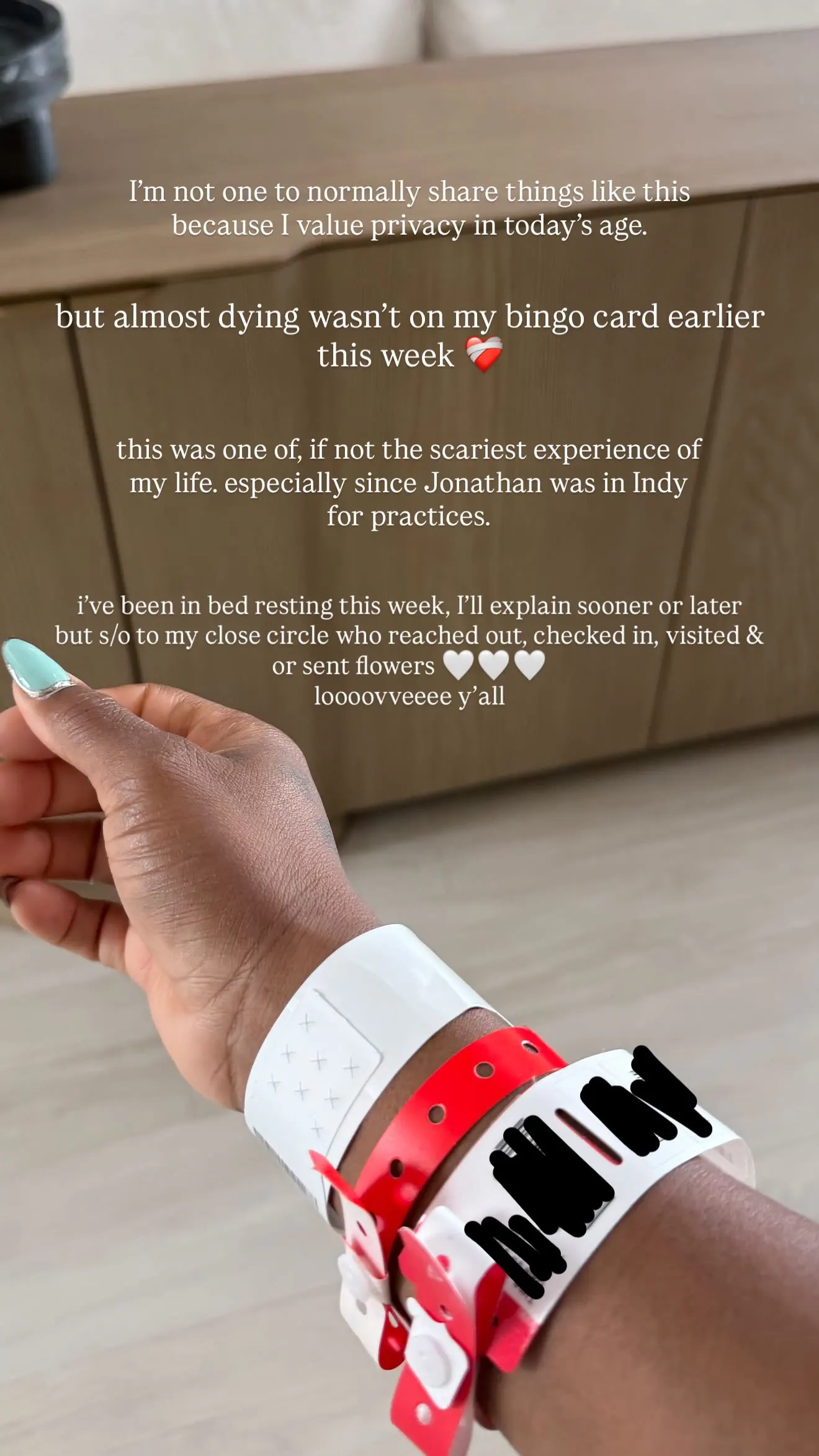 A person's arm wearing several medical wristbands, with text about a scary, near-death experience.