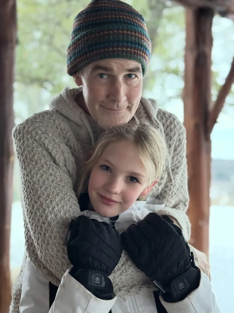 James Van Der Beek embraces his daughter.