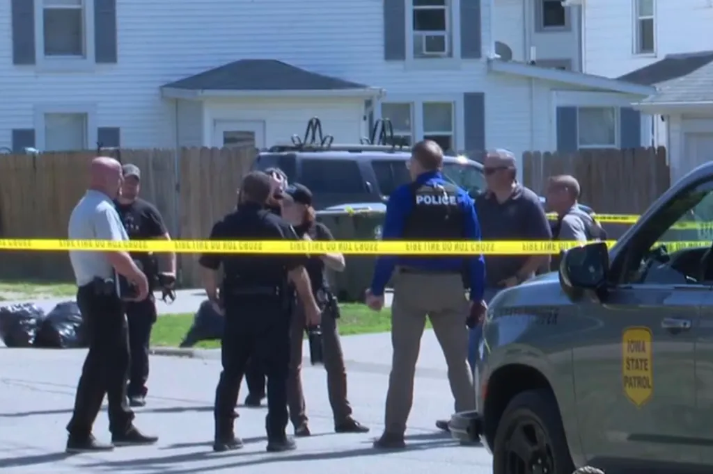 Police and forensic teams at the scene of the Muscatine, Iowa shooting.