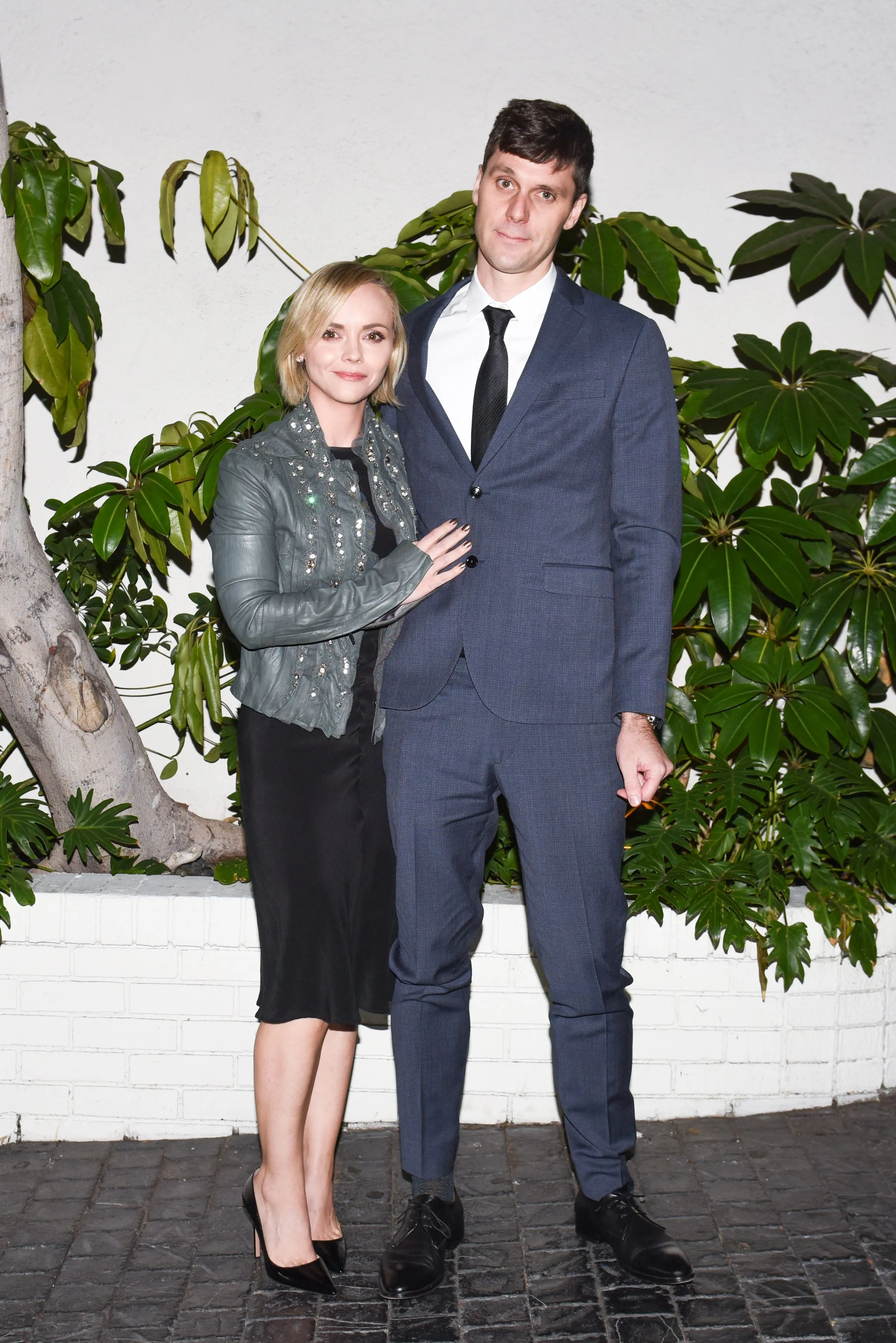 Christina Ricci and James Heerdegen posing together at a formal event.