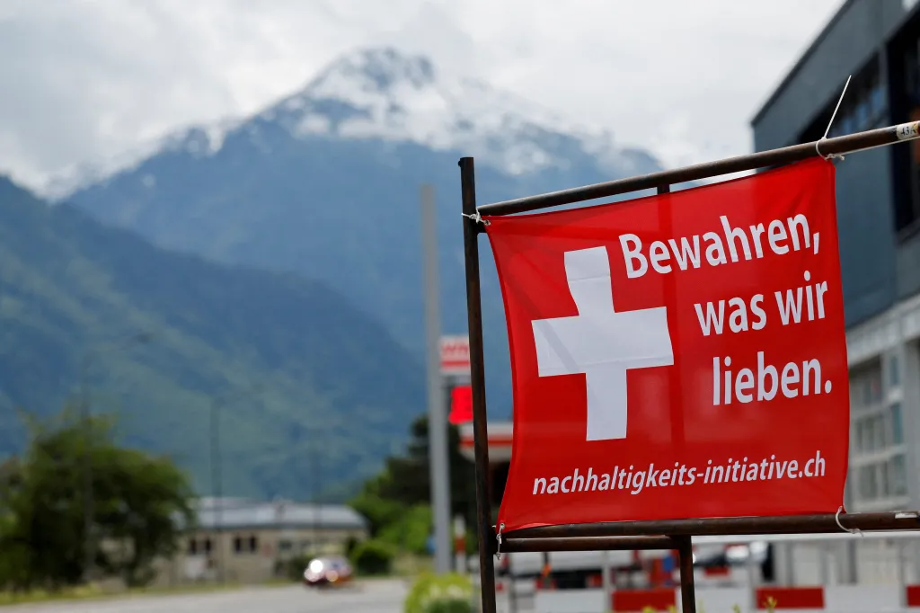 A red sign with a white Swiss cross and the German text 