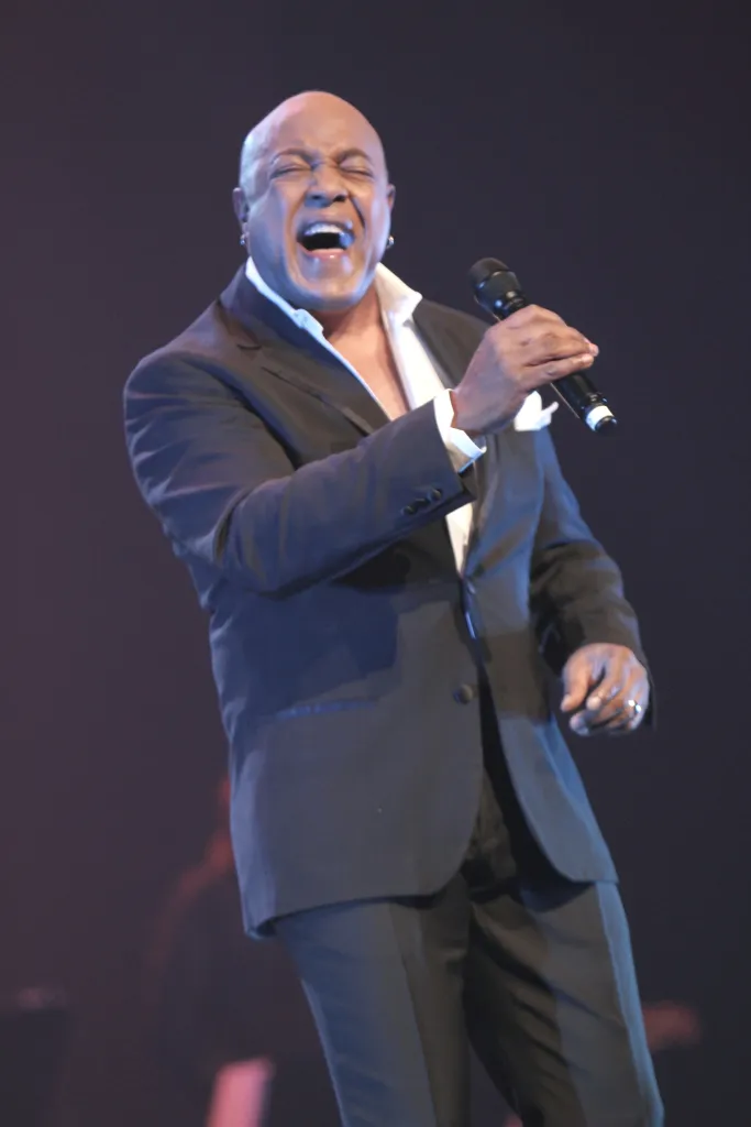 Singer Peabo Bryson performing on stage.