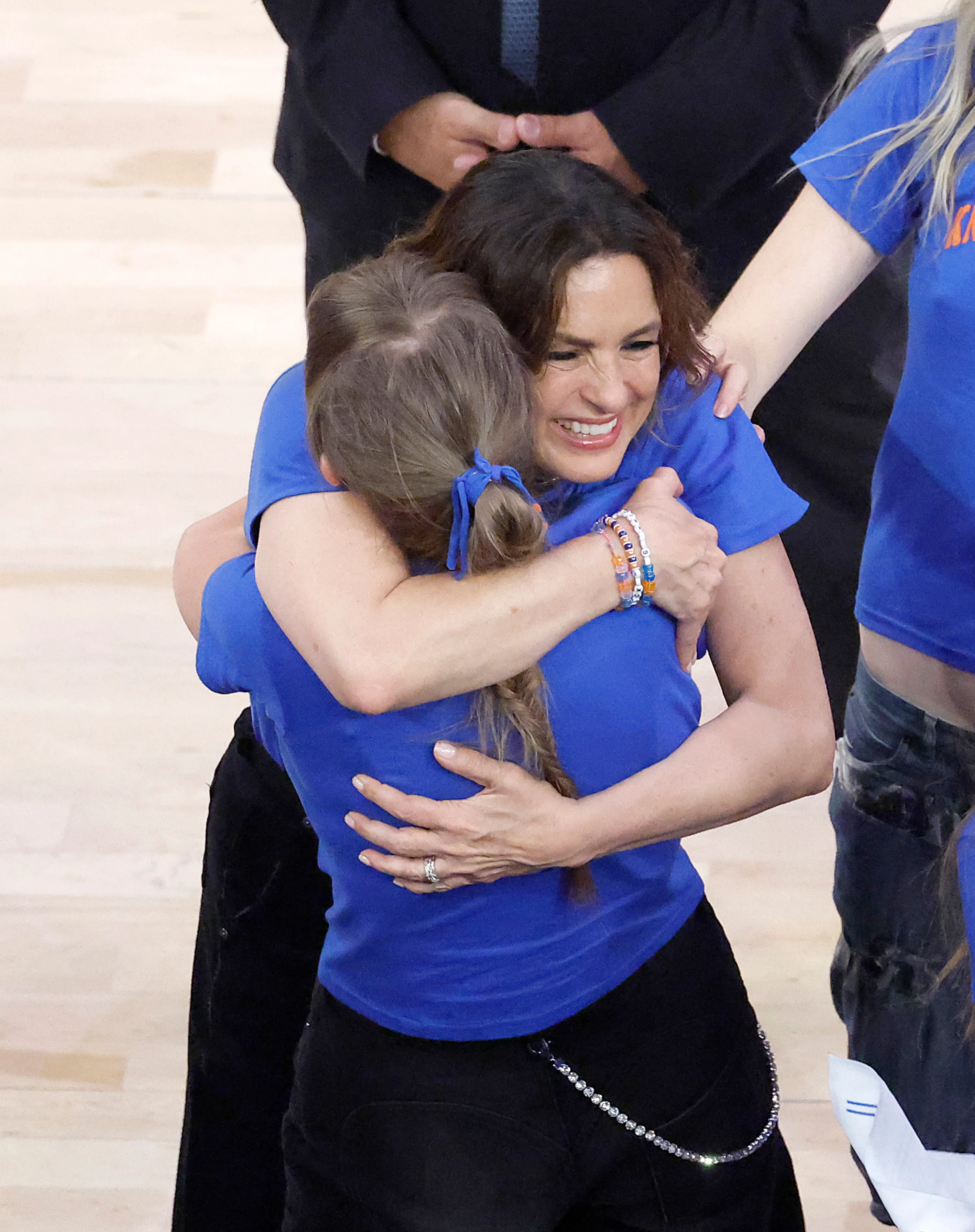 Actress Mariska Hargitay hugs singer Taylor Swift during Game 4 of the 2026 NBA Finals.