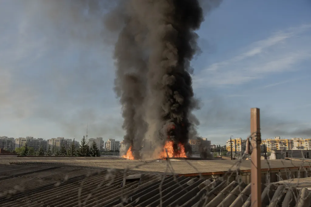 Smoke and flames rise from garages damaged during a Russian missile and drone strikes, in Kyiv on June 2, 2026, amid Russian invasion in Ukraine.