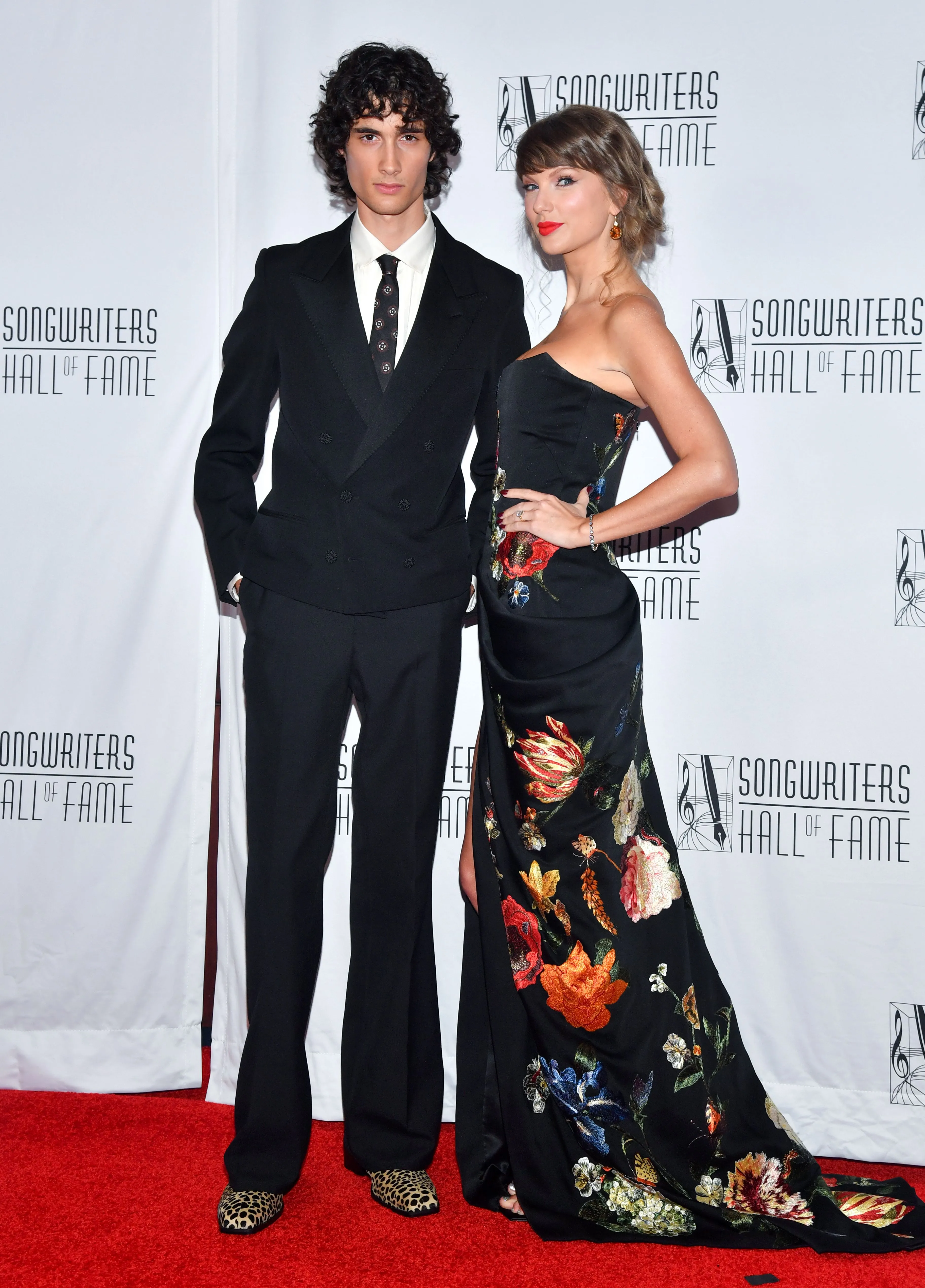 Taylor Swift and Sombr posing on the red carpet at the 55th Annual Songwriters Hall of Fame Induction and Awards Gala.