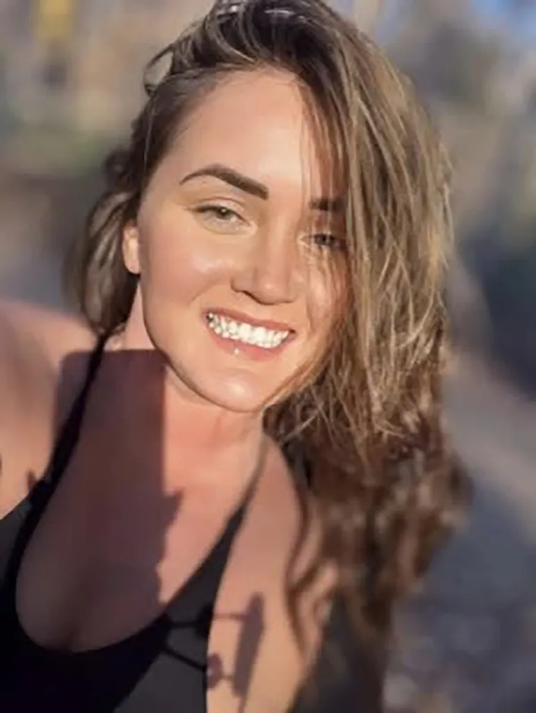 Elena Moore, a missing South Carolina personal trainer, smiling at the camera.