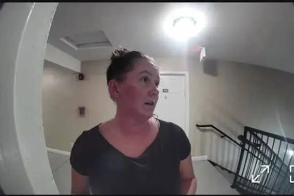 Elena Moore, a personal trainer from South Carolina, seen in a building hallway in a security camera image.