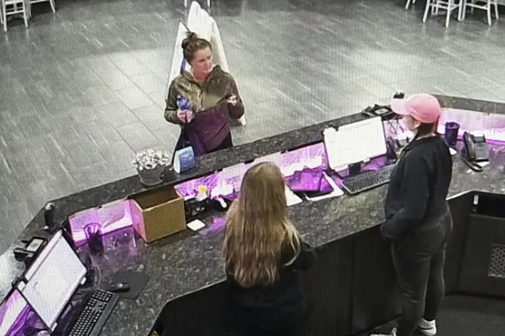 CCTV footage shows Elena Moore, a personal trainer, standing at a counter with two other people.