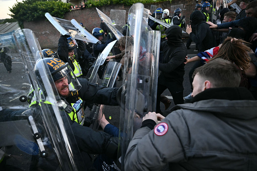 U.K. Prime Minister Condemns Violent Protests as Police Face Criticism Over Handcuffed Student’s Murder