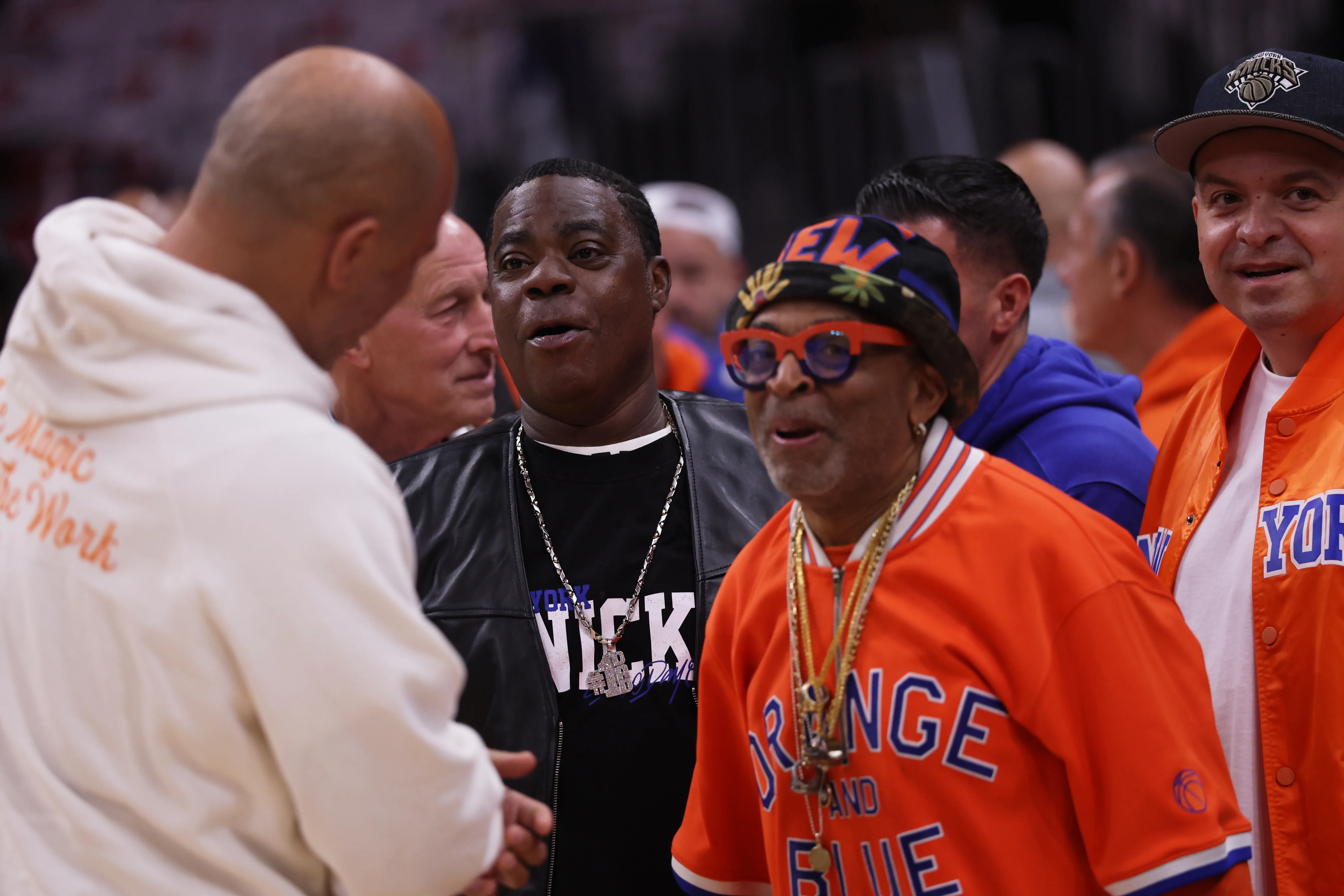 Spike Lee, right, and Tracy Morgan, center, greet Rick Brunson.
