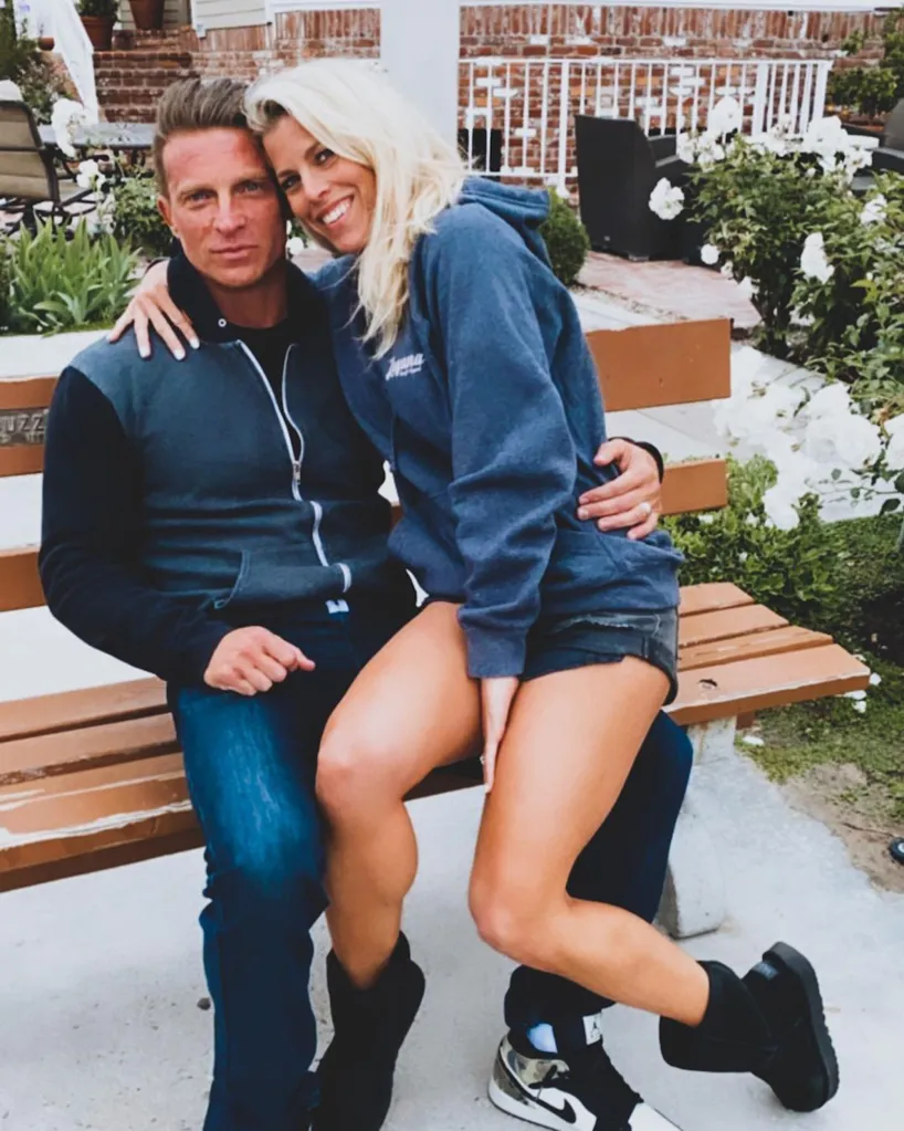Steve Burton and Sheree Burton posing together on a bench.