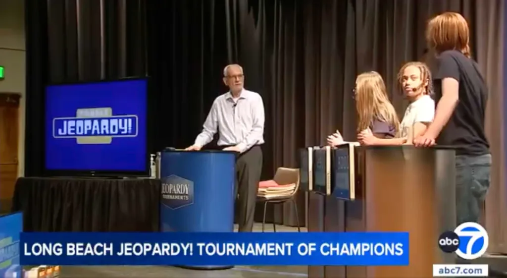Jim Birge hosting a student Jeopardy! tournament in Long Beach.