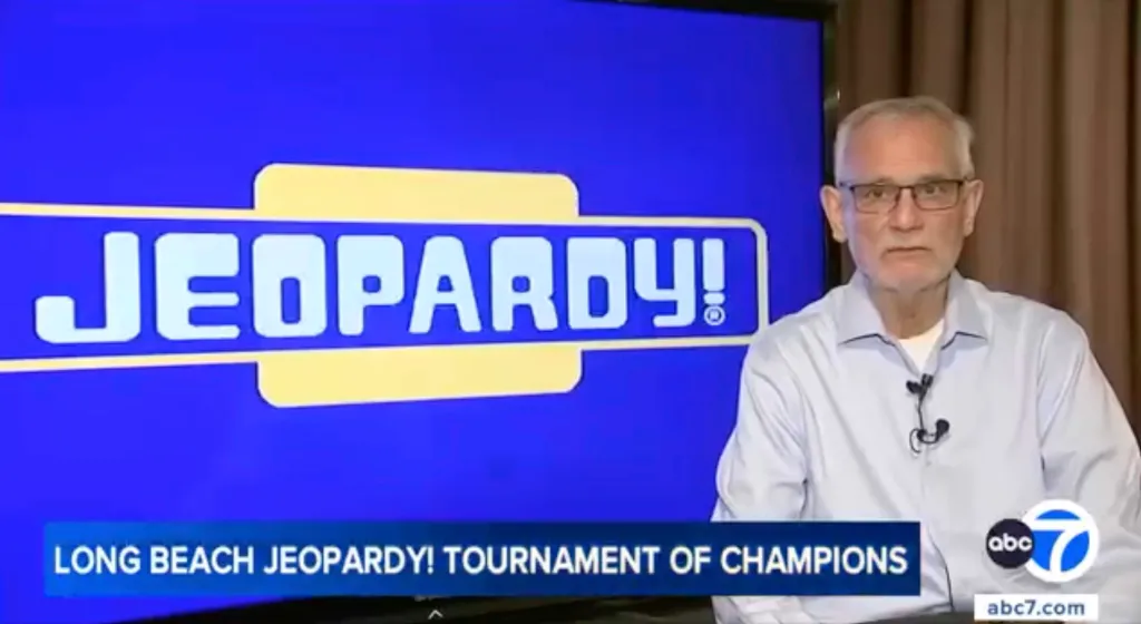 Jim Birge, a man in glasses and a light blue shirt, is shown on screen next to the
