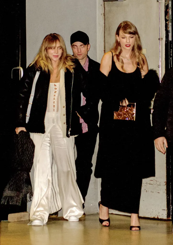 Suki Waterhouse, Robert Pattinson, and Taylor Swift walking together.