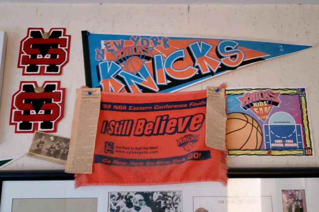 Knicks fan memorabilia, including a New York Knicks pennant, an