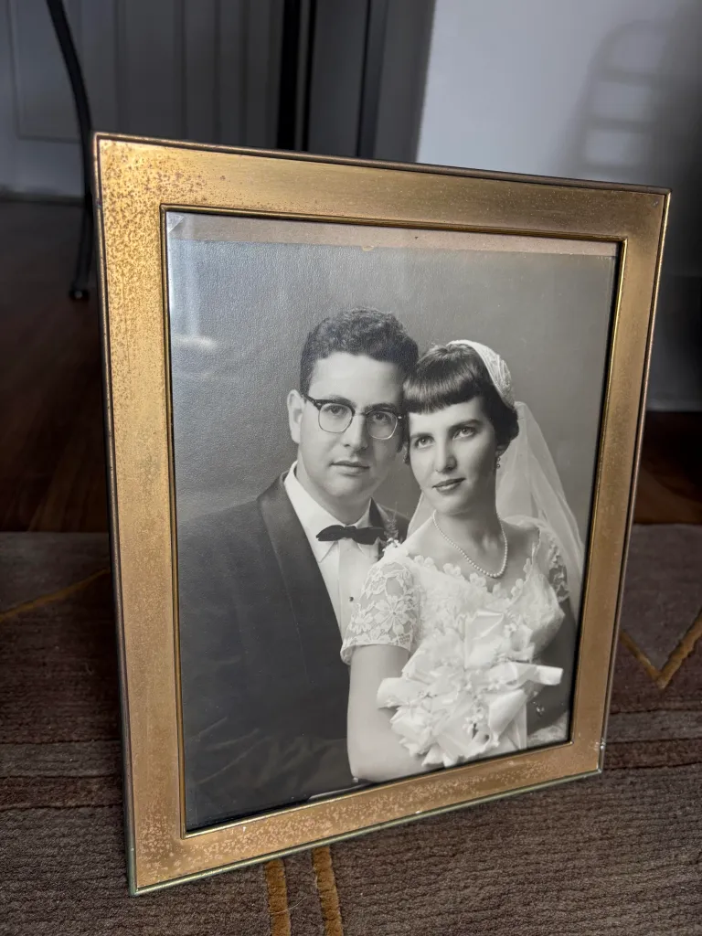 Sol and Vicky Rosenblatt's black and white wedding photo in a gold frame.