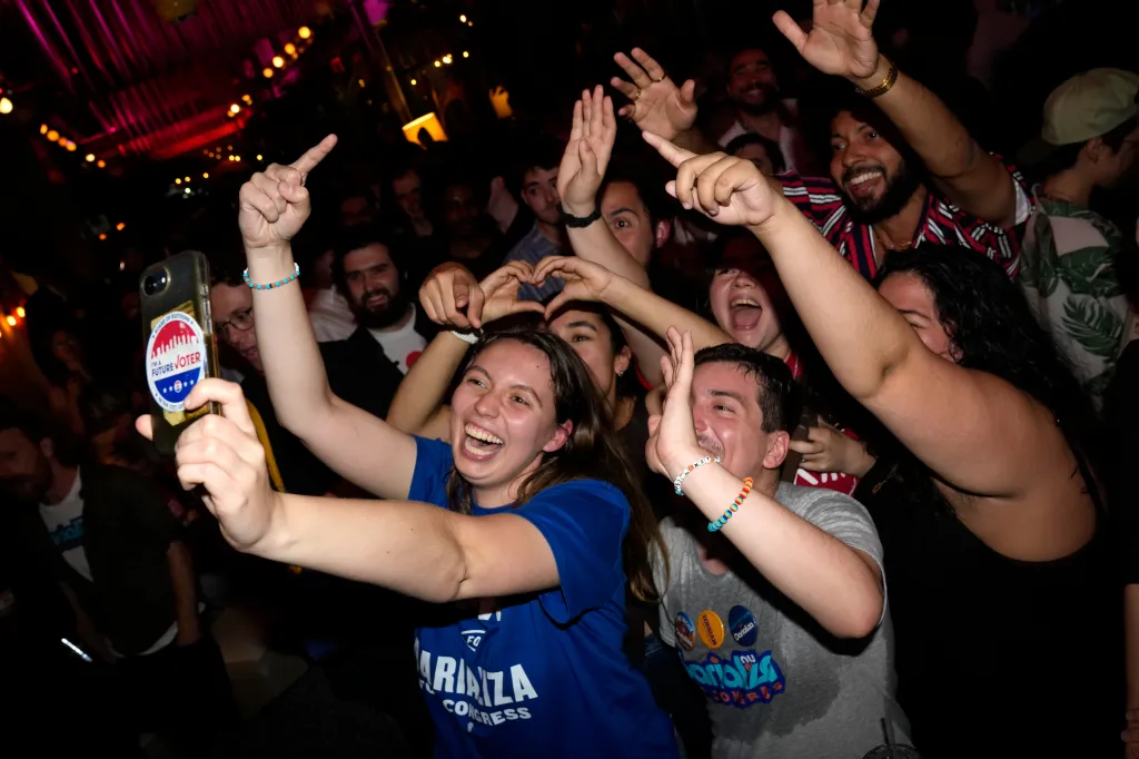 Supporters celebrate Democratic congressional candidate Darializa Avila Chevalier at an election night watch party.
