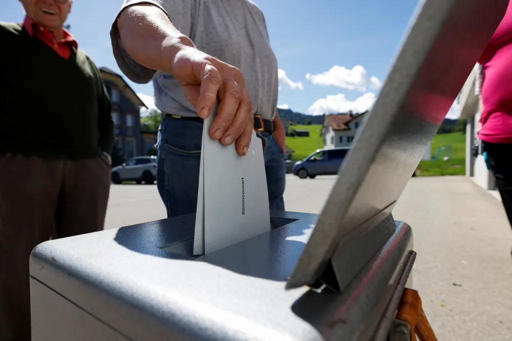A person placing a ballot labeled 