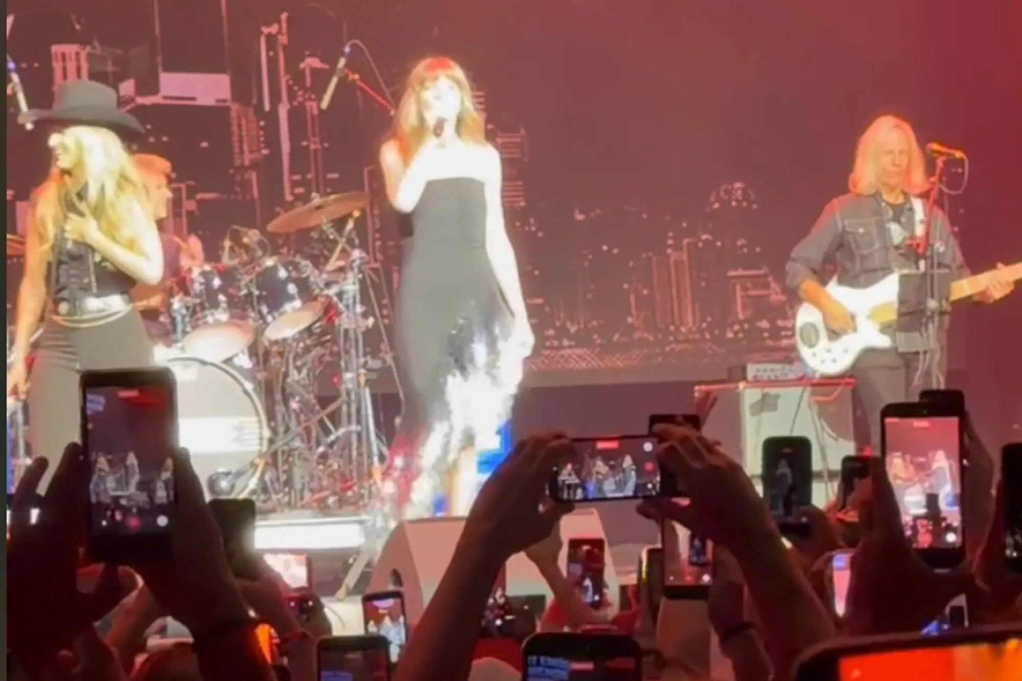 Taylor Swift attending Travis Kelce's Tight End University concert.