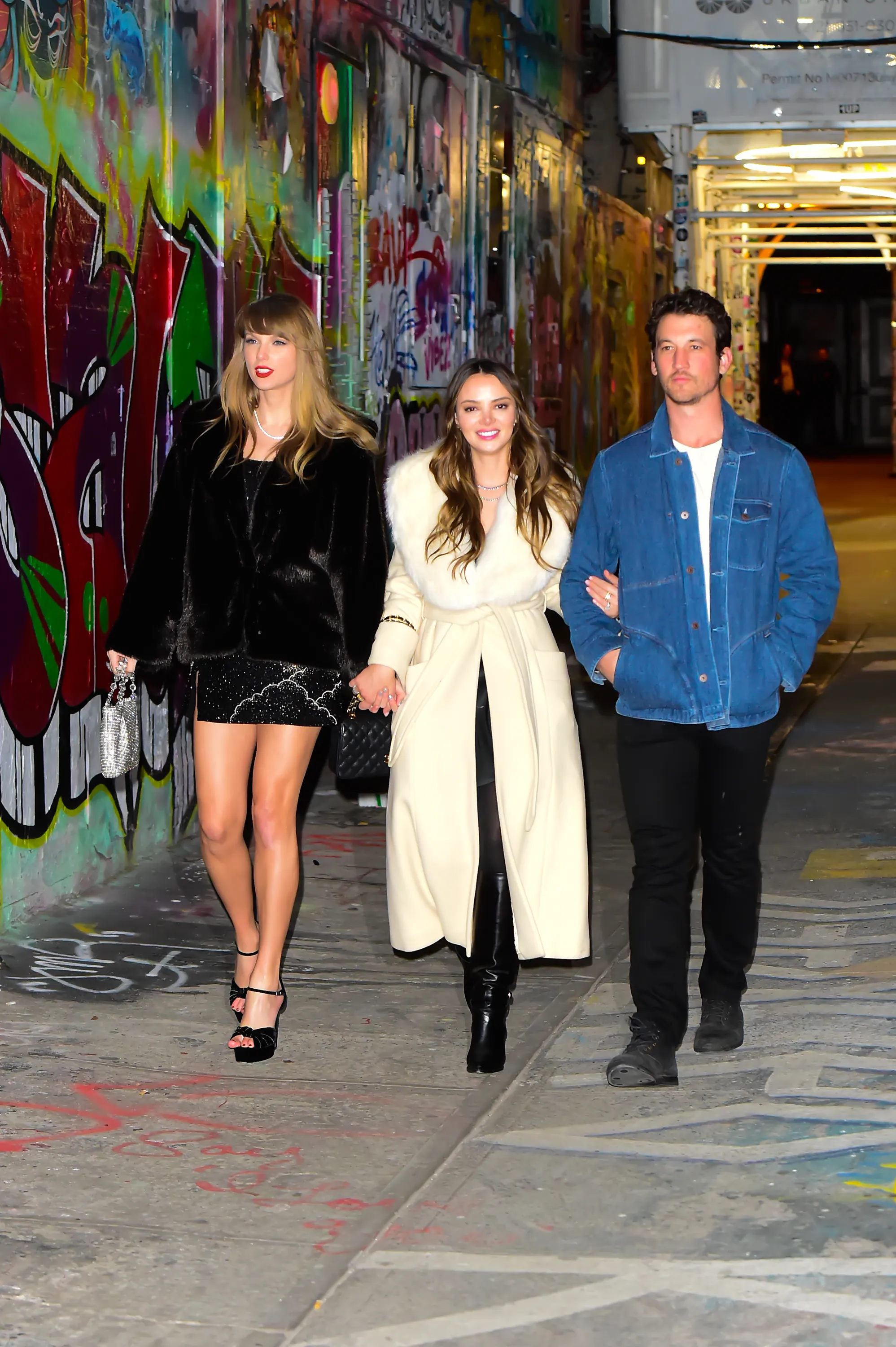 Taylor Swift (L) celebrates her birthday with Keleigh Teller and Miles Teller on December 13, 2023 in New York City.