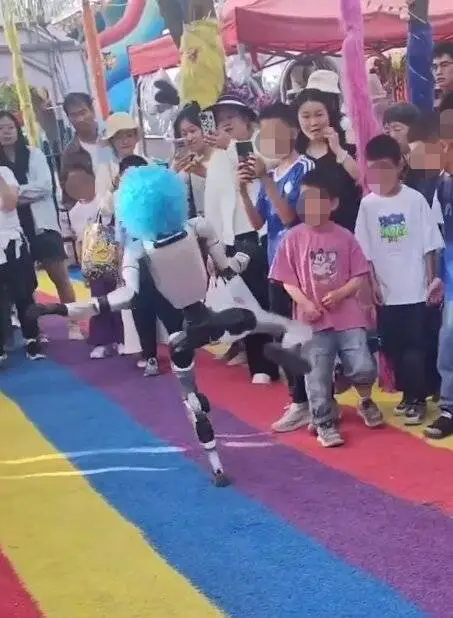 A robot in a blue wig kicking a child